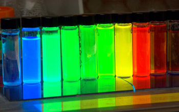 A line of containers with quantum dots emitting different colors