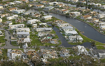 Aerial photo of damaged homes in the aftermath of a hurricane