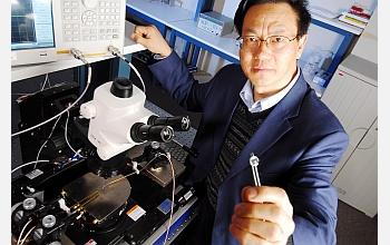 Georgia Tech researcher Zhong Lin Wang holds a prototype nanogenerator.