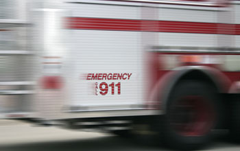 Photo of a fire engine in motion, responding to 911 call