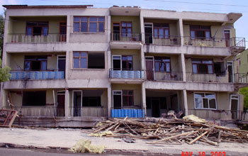 Four-story apartment building collapse following earthquake