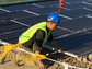 Technicians installing solar panels