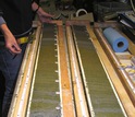 Split sediment cores from offshore Alaska, showing green laminated diatom-rich layers.