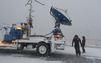 DOW scientists Karen Kosiba and Traeger Meyer with radar truck