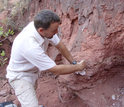 scientist working on a rock