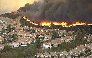 Approaching wildfire threatens a subdivision