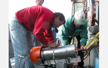 Scienitsts prepare the high-definition TV camera for loading onto a remotely operated vehicle.