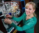 oceanographer Katie Shamberger with instruments that measure carbon dioxide in seawater.