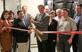 Photo of Director Charlie McMilan cutting the ribbon at Research Park in Los Alamos, New Mexico.