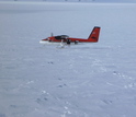 A Twin Otter aircraft on snow covered ground