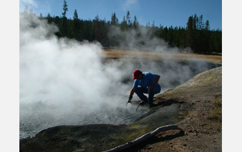 Lucigen's David Mead collects water samples from Obsidian Hot Spring