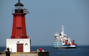 The R/V <em>Sikuliaq</em> is seen here getting a tow on the Marinette River in Wisconsin