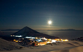 Moon shines over McMurdo Station in June, when there is 24-hour darkness during winter
