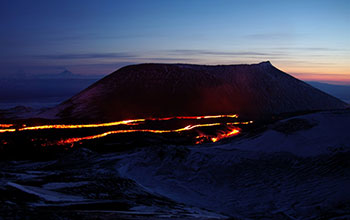 Trails of lava snake over landscape around the Tolbachik volcano