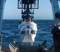 scientists pulling vehicle Alvin from the water