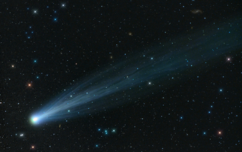 photo of comet Ison in the sky through a telescope
