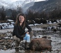 Researcher with water sample taken from the Big Thompson River