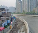 view of apartment buildings roads and houses in a city