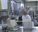 Students working in an advanced manufacturing lab setting