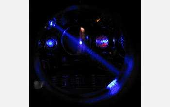 Shining a blue laser onto ultracold strontium atoms in an optical trap