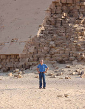 Photo of a man in front of one of the pyramids