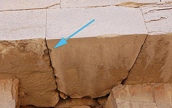 Close up photo of blocks with an arrow pointing to a cavity.