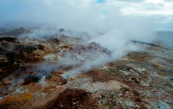 volcanic mountaneous area near Reykjavik, Iceland, with steam rising