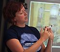 Beth Orcutt discusses CORK microbiology experiments with colleagues during the expedition.