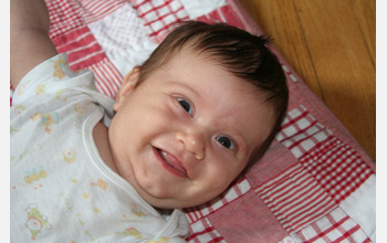 Photo of a smiling baby.