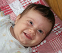 Photo of a smiling baby.