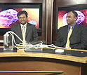 Photo of two researchers and webcast host in the studio.