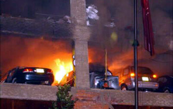 After bombing, cars continue to burn in garage of El Nogal social club, Bogota, Columbia.