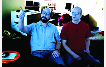 Photo of 2 researchers wearing 3-D glasses.