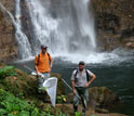 Photo of Marcus Kronforst (left) and Ryan Hill (right) hunting for butterflies in Ecuador.