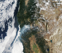 satelite photo from August 2014 showing large wildfires burning in Northern California.