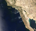 satelite photo showing large, fast-moving wildfires in Southern California in May 2014