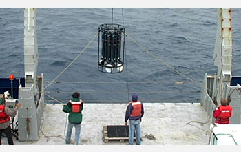 University of Hawaii researchers use taglines to control sway of sampling device entering water.