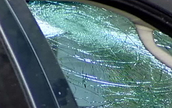 Shattered safety glass in car windshield