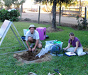 Researchers George Slad and Anne Meltzer install a seismic station near a farmhouse in Chile.