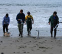 Photo of the sampling team conducting beach surveys after the quake.