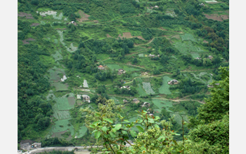 Photo of rural China showing agricultural development and fragmented forests.