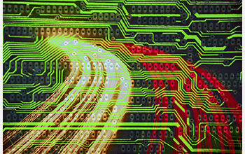 A graphic depiction of a computer circuit board with light streaks across it.