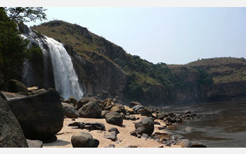 Photo of waterfall cascading down the steep cliffs of the lower Congo River.