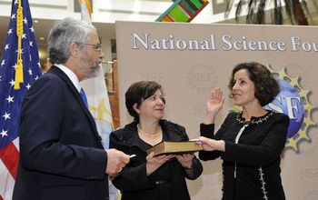 France Cordova being sworn in with John Holdren and Adrienne Cordova