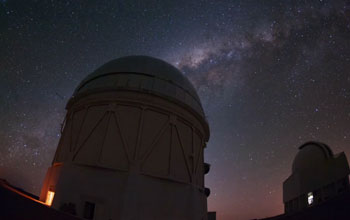 Telescope with sky full of stars