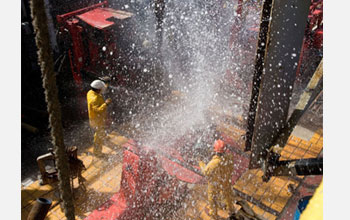 Seawater sprays on the JOIDES Resolution rig floor during drilling operations.