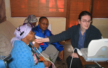 Photo of linguist Johanna Brugman of Cornell, right, with Ouma Katrina Esau and Willem Damarah.