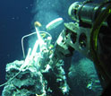 a robotic device measuring chemosynthetic processes at a hydrothermal vent in deep ocean.