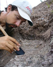 Paleontologist Christian Sidor excavates a fossil in Tanzania.