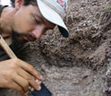 Paleontologist Christian Sidor excavates a fossil in Tanzania.